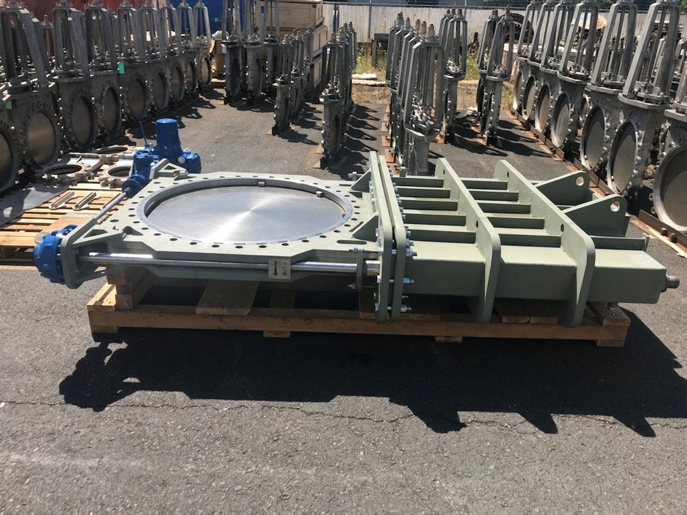 Large knife gate valve with electric actuator crated on a pallet in the yard