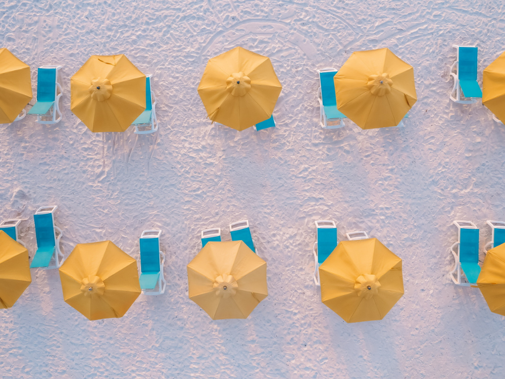 Yellow beach umbrellas seen from above