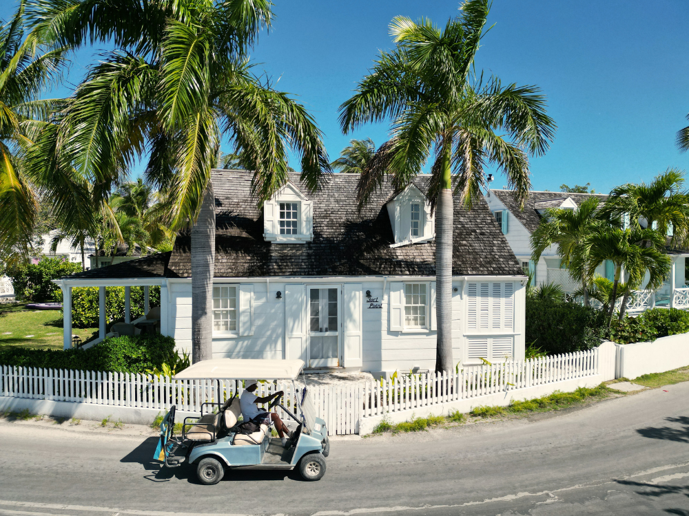 Harbour Island home with a golf cart parked outside