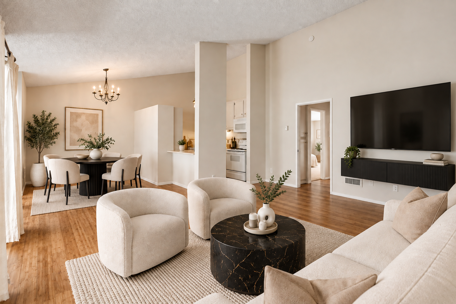 Living and dining room under a vaulted ceiling, virtually staged