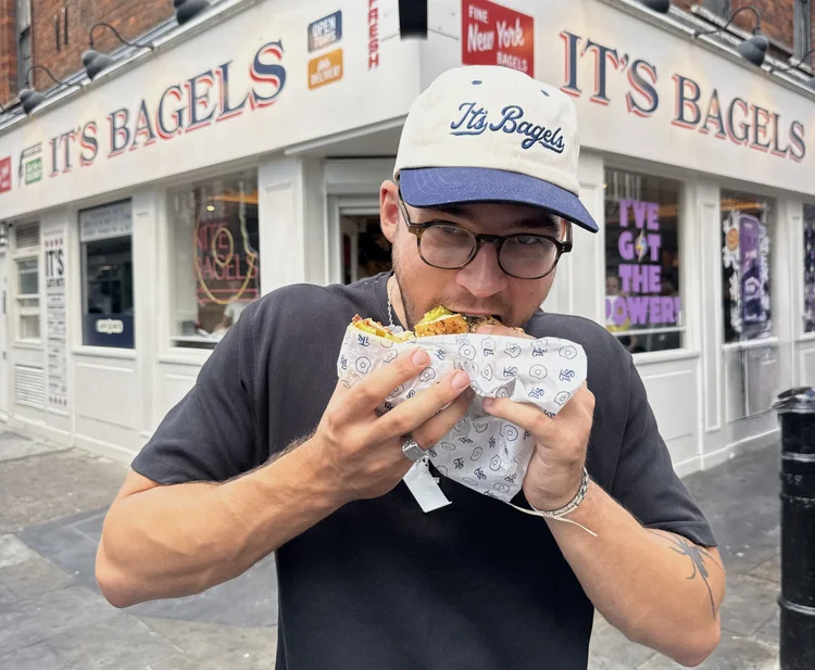 Eating a bagel outside It's Bagels