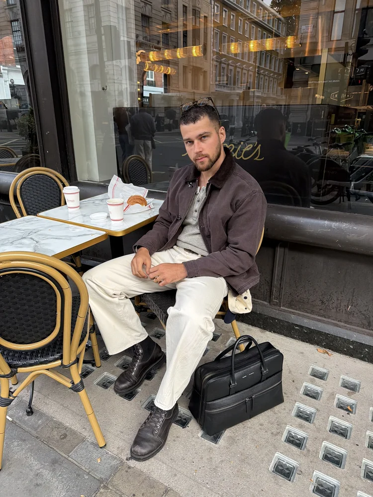 Cafe terrace in a brown jacket