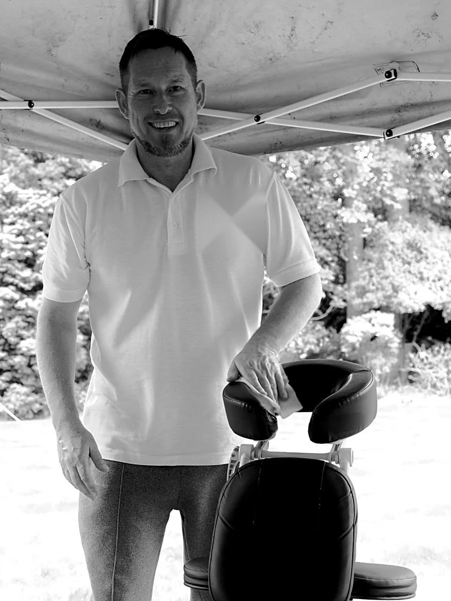 Estuary therapist with a massage chair under a gazebo, ready for cast and crew