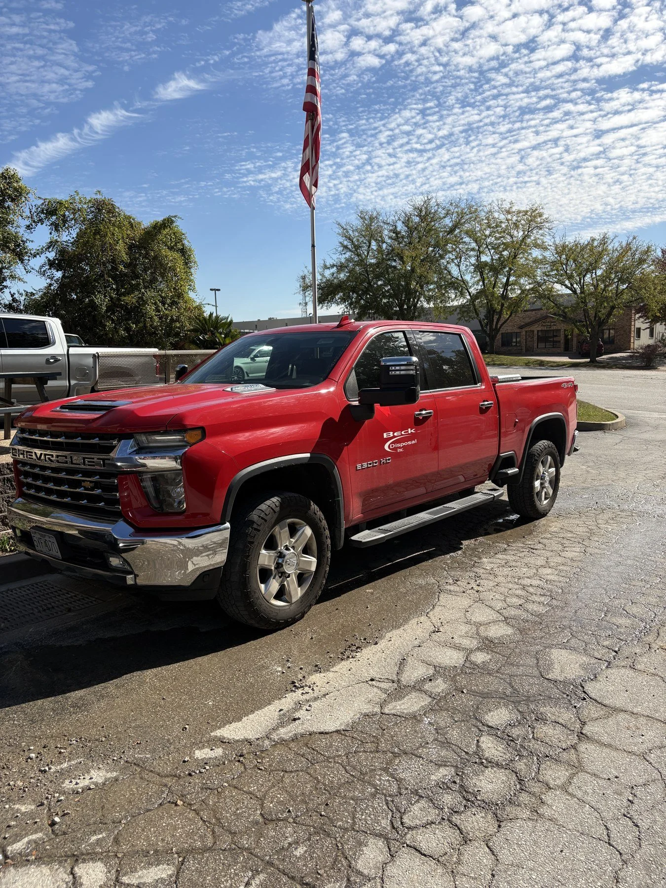 Red Beck Disposal pickup truck outside the company facility