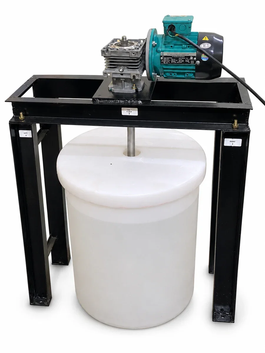 Focus agitator with geared motor on a steel stand over a chemical solution tank