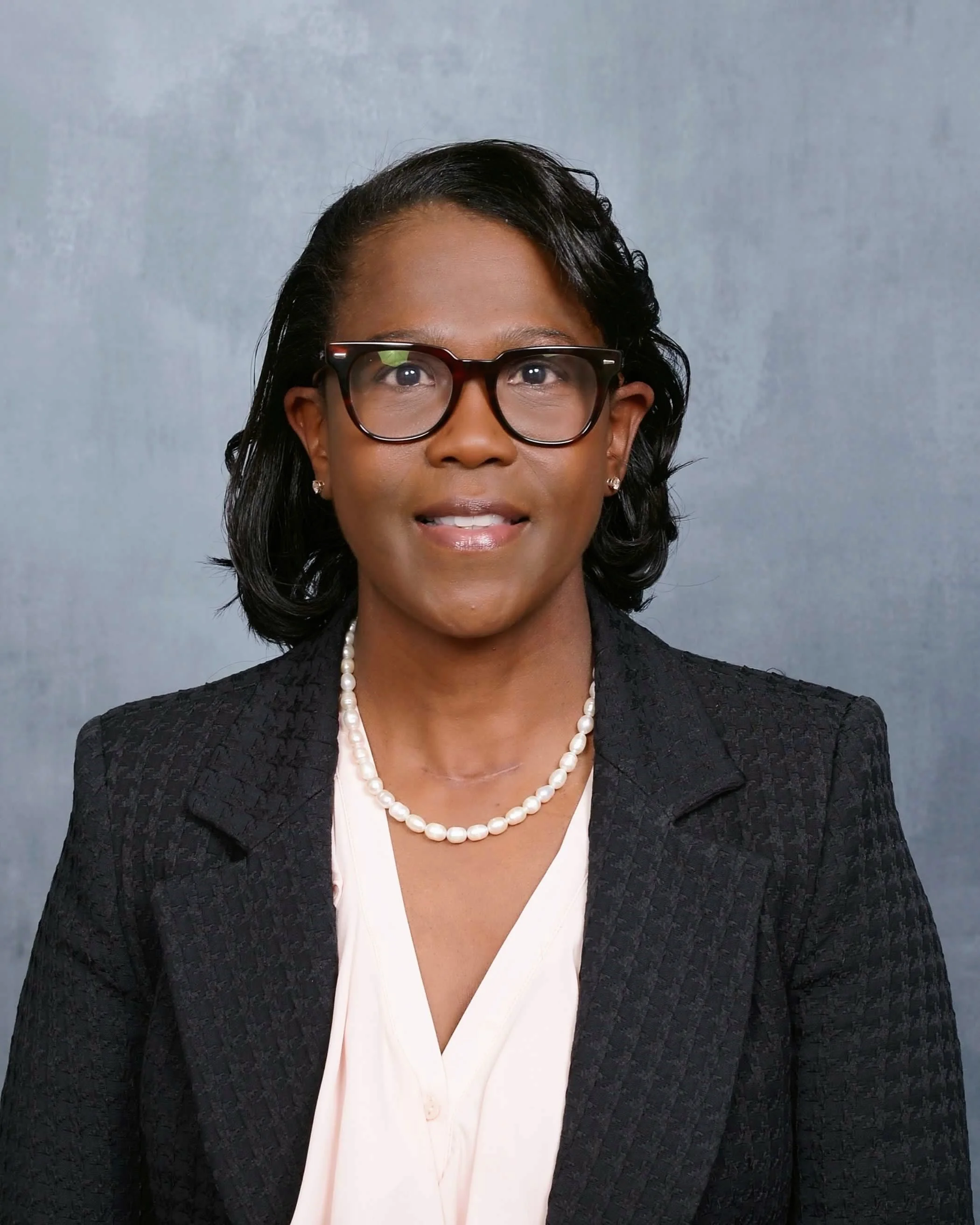 Portrait of Dr. LaShanda Cobbs wearing a black blazer and pearls
