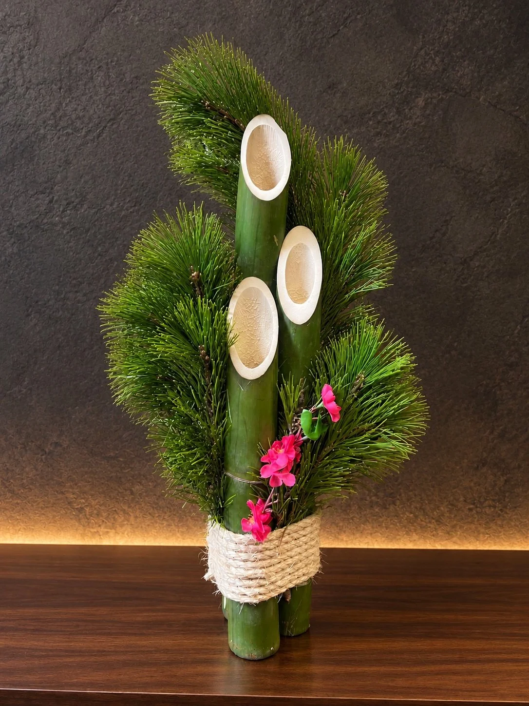Hawaiʻi Traditional kadomatsu design 2 with three bamboo shoots, pine, pink blossoms and natural rope binding