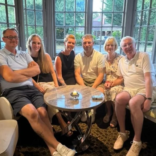 A family group in the lounge