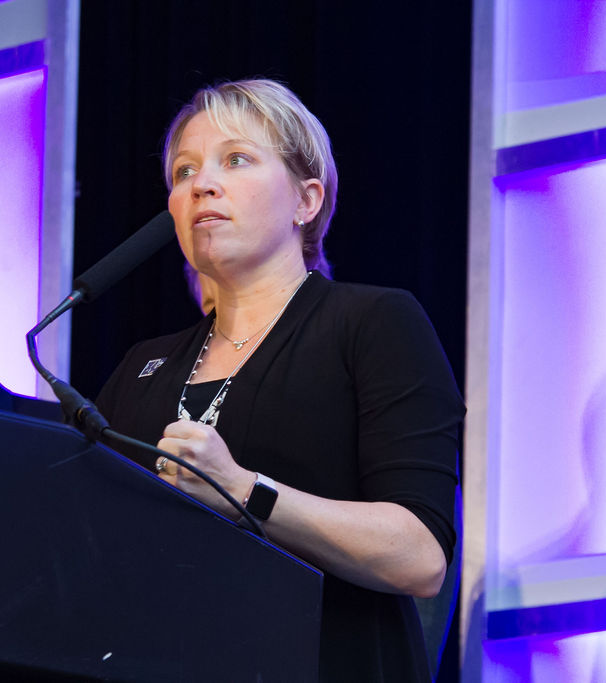Rebecca West Burns speaking at a professional education conference
