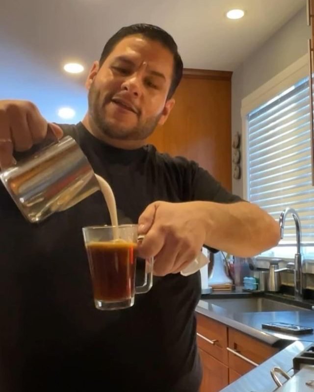 Louie pouring the froth in his Connecticut kitchen
