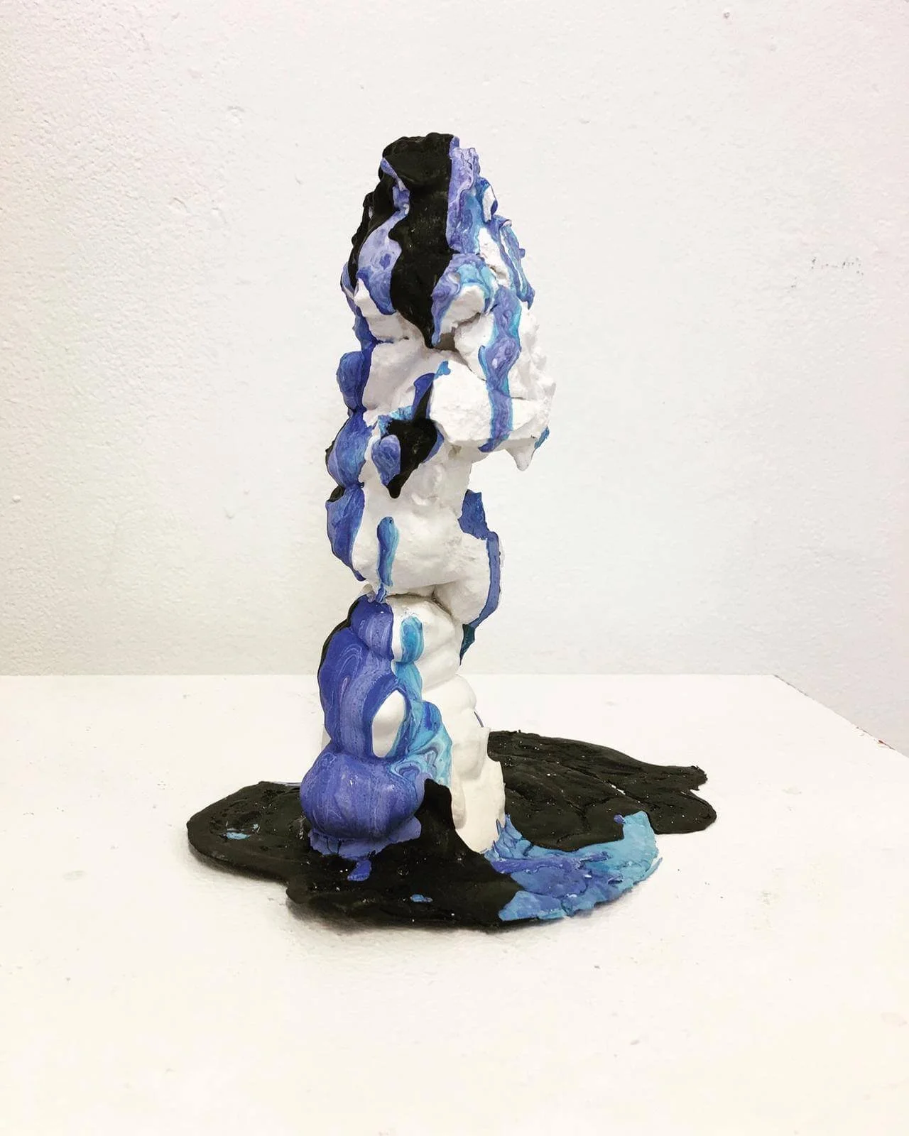Black Lake by Su Taşkın, an upright plaster form with poured blue, white and black acrylic