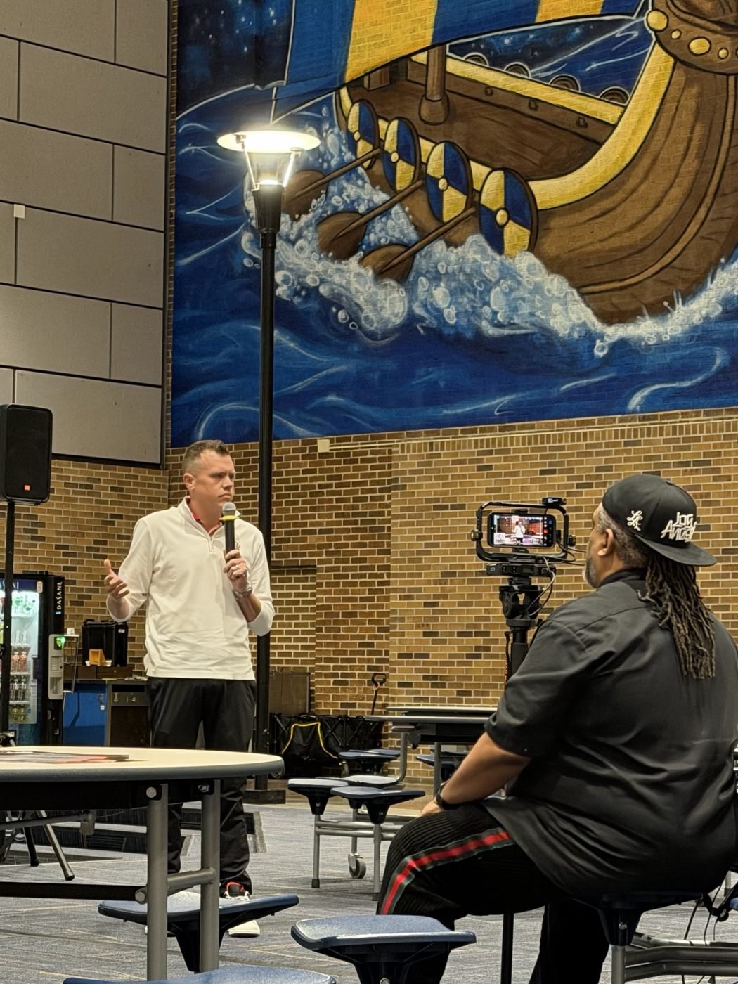 Taking questions at a community forum