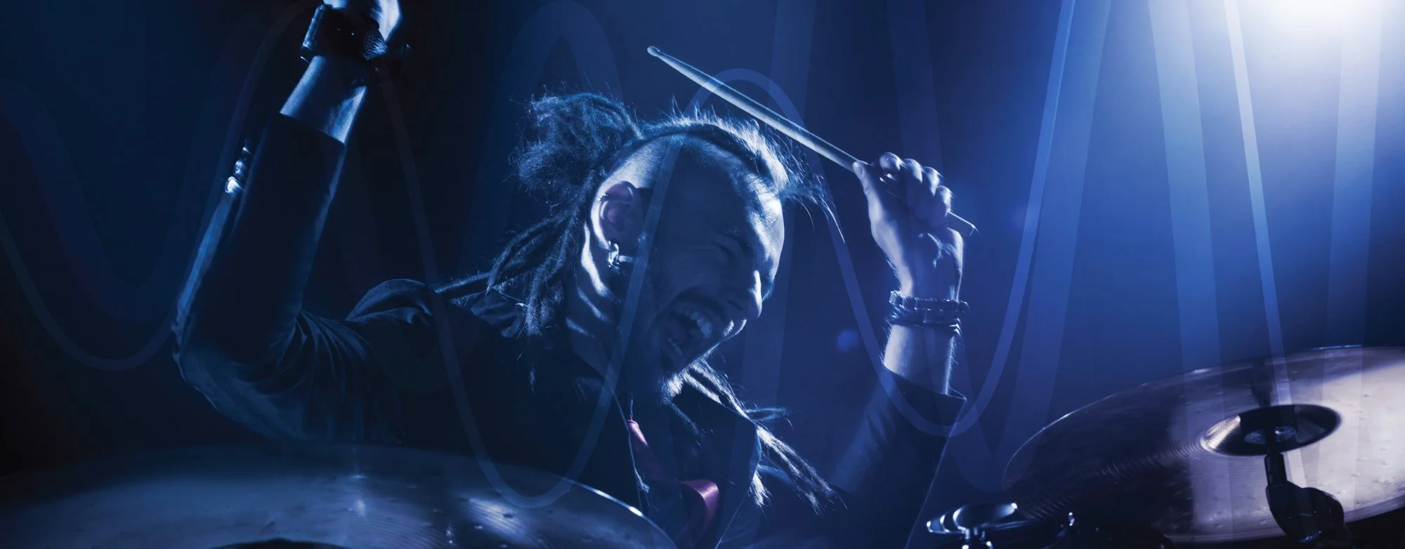 Drummer on stage wearing Westone Audio in-ear monitors