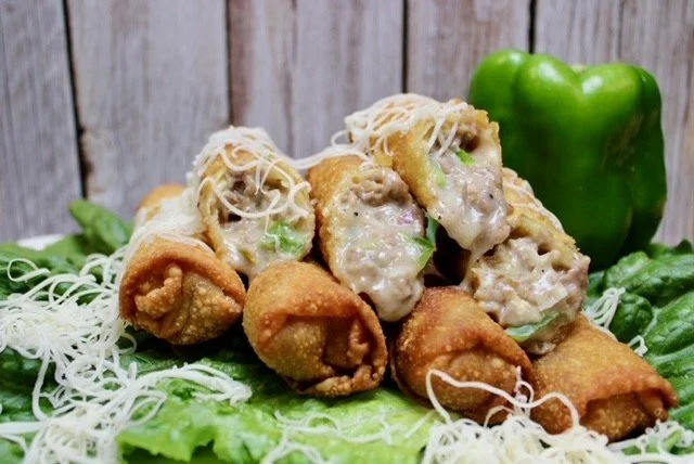 Philly Cheesesteak Roll, cut open to show the filling