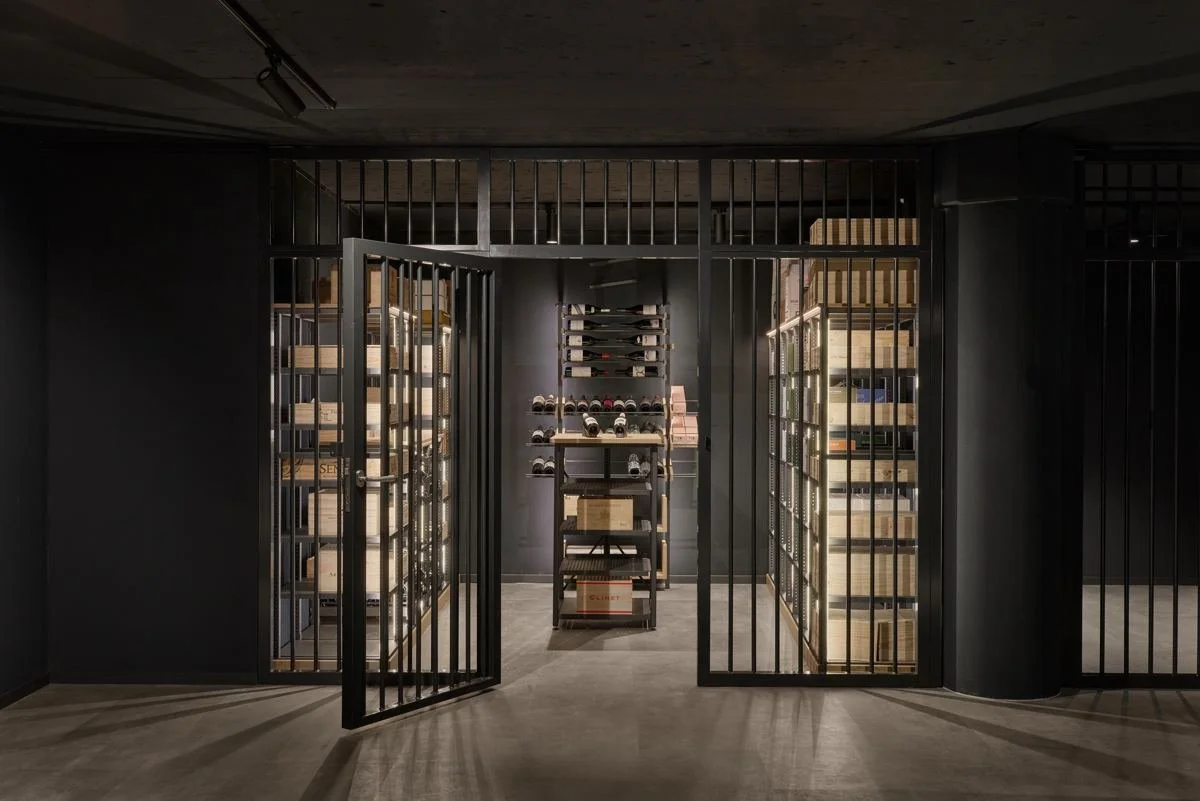 A private walk-in cellar behind a steel gate