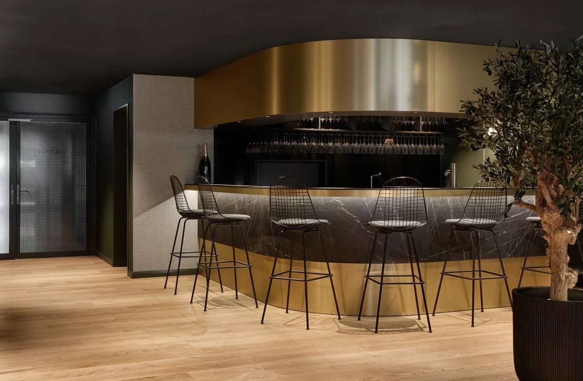 The brass and marble bar