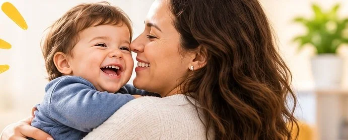 Caregiver supporting a young child during play
