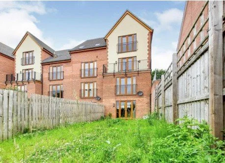 The rear of the town houses with gardens