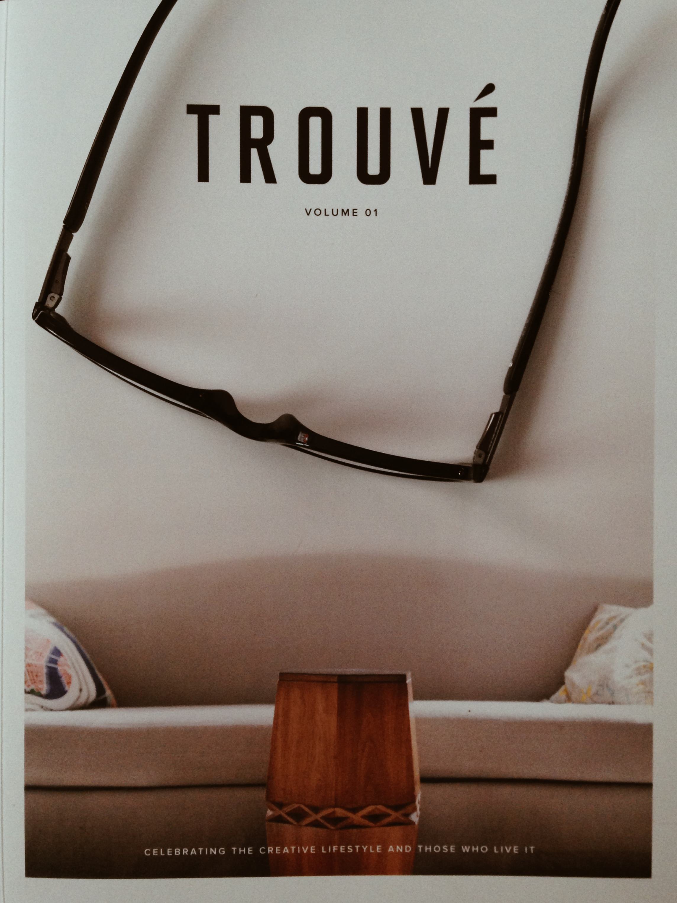 The cover of Trouvé shown with my reading glasses.