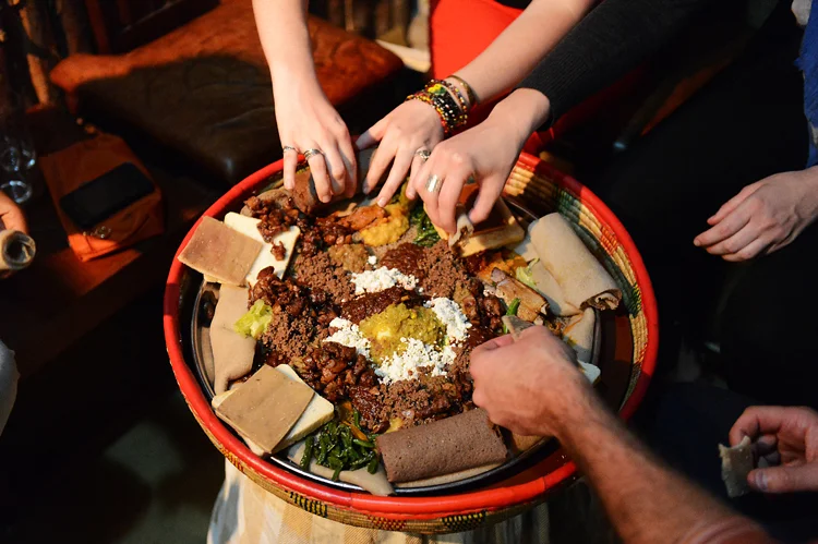 At the end of our first day, we shared a traditional Ethiopian meal. Ethiopian food is meaty, spicy, shared communally, and there aren't any utensils; you eat with your hands. There's something very intimate about sharing a meal this way, i think. It feels like a wonderful way to seal new friendships.