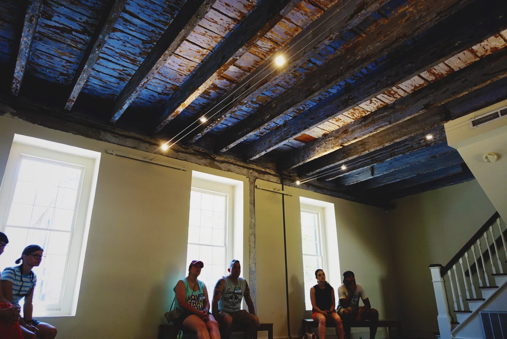 The interior of the slave quarters. Two things to note: the staircase is a much later edition — like in the last few years. To go up to the sleeping quarters upstairs, the enslaved would have used a ladder. Also, see the blue ceiling? It was painted that colour using a combination of lime, indigo and buttermilk. It was a West African belief that the blue colour would protect the inhabitants from evil spirits stealing their souls as they slept. And speaking of inhabitants, approximately 14-16 enslaved people slept in these quarters, which I would estimate to be about 1000 square feet in total.
