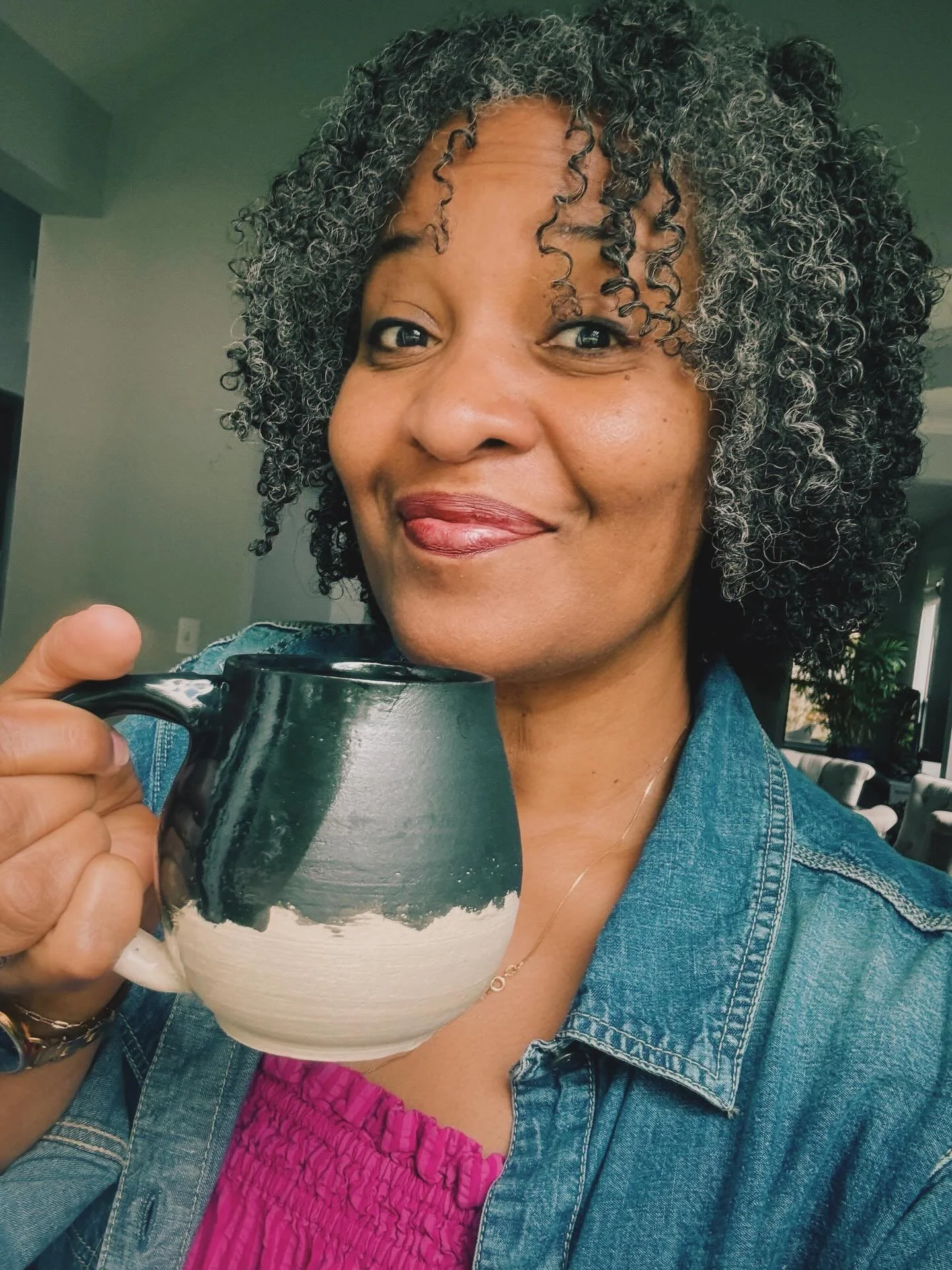 Portrait of the indubitably amateur potter and the mug she made.

(I now have a set of 8 non-identical-mugs-despite-trying-to-make-them-identical, and 8 similarly-non-matching bowls, so if anyone wants to come over for a breakfast of fruit and yogurt