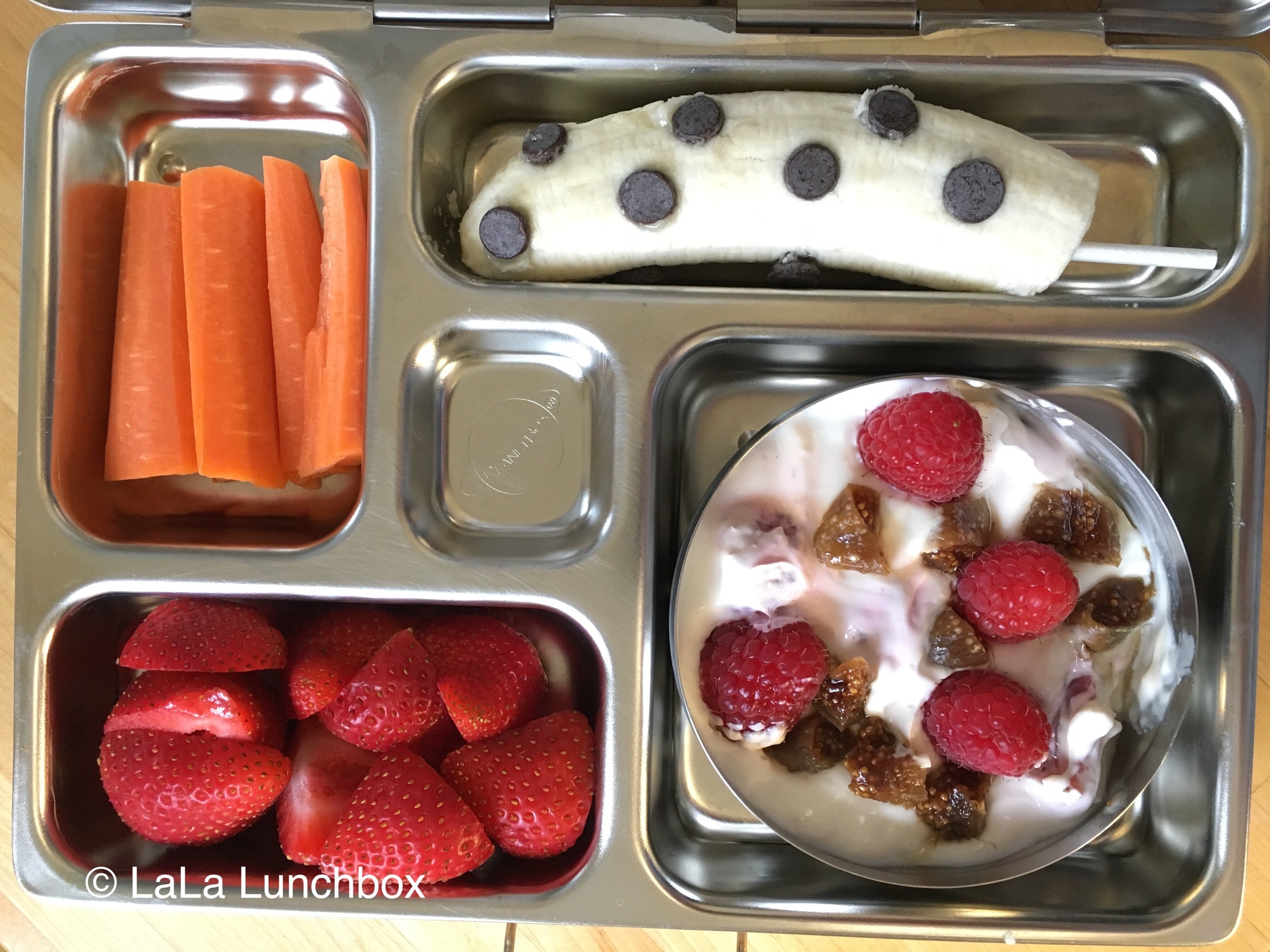 100 Days of Real Food - My kindergartner took her PlanetBox lunch box again  today. It works pretty well for this homemade pizza lunchable combo,  which includes: Plain whole-wheat pizza crusts, tomato