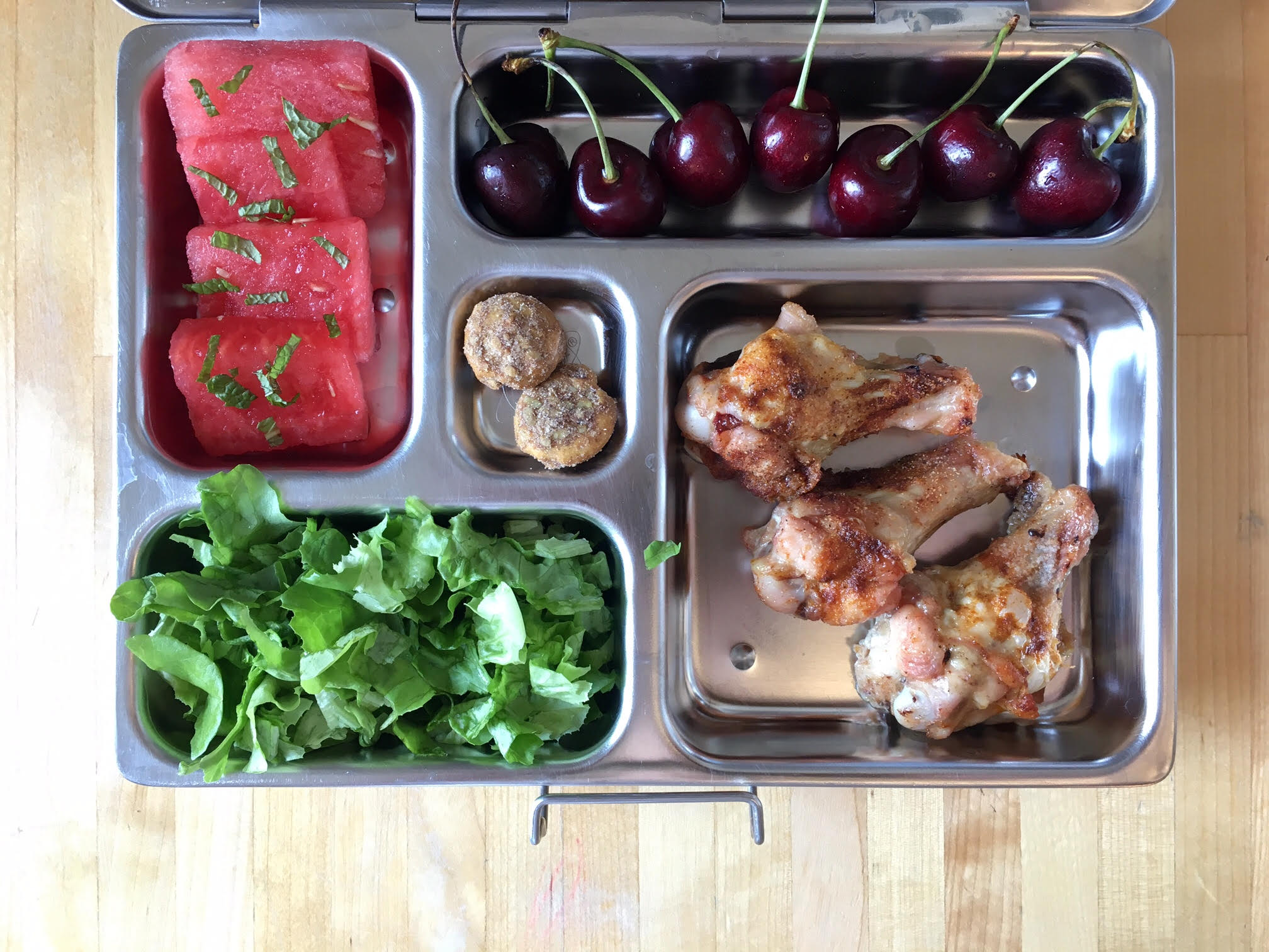 Leftover chicken drumettes, cherries, watermelon with mint, salad, sunflower seed cookies