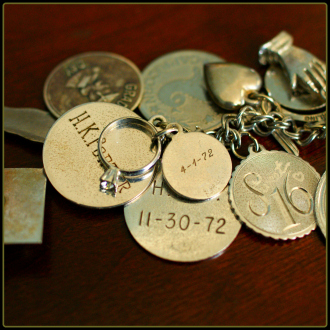 My favorite charm: the one commemorating her engagement to my dad.