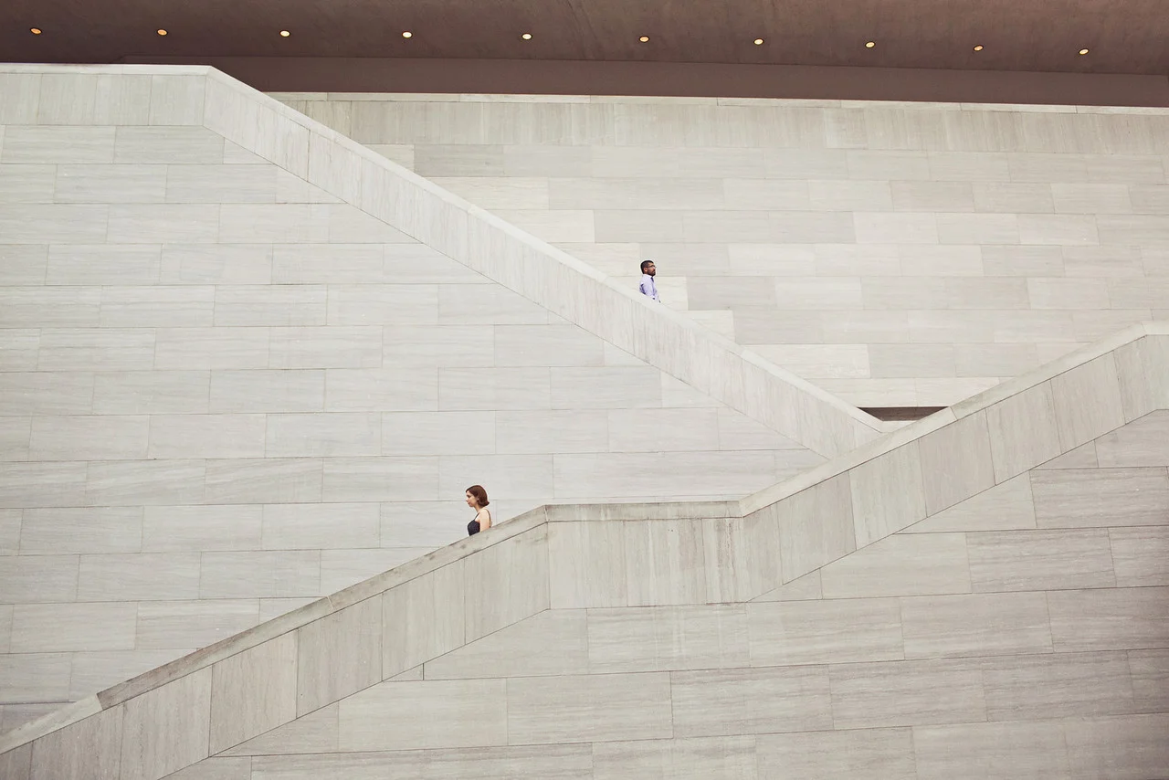 Engaged couple on escalators in the National Gallery of Art in Washington, DC - Maria Vicencio Photography Engagement Session