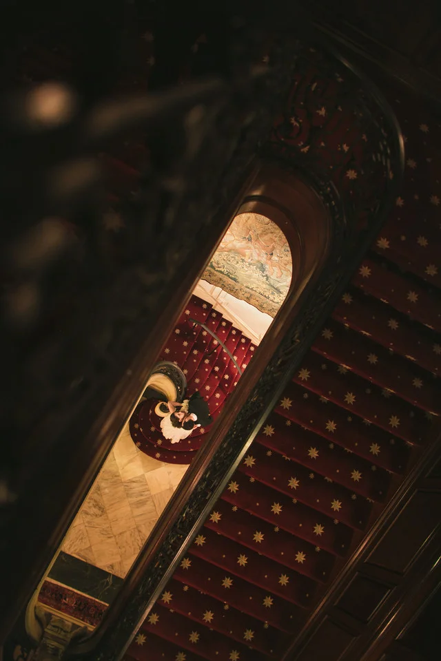 Bride and groom on stairs of the Cosmos Club - Maria Vicencio Photography Weddings