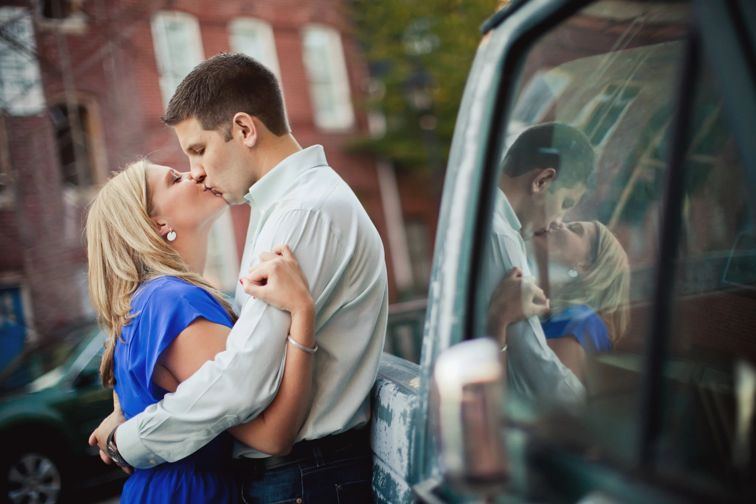 Engaged couple kissing in Fells Point in Baltimore, MD - Maria Vicencio Photography Engagement Session