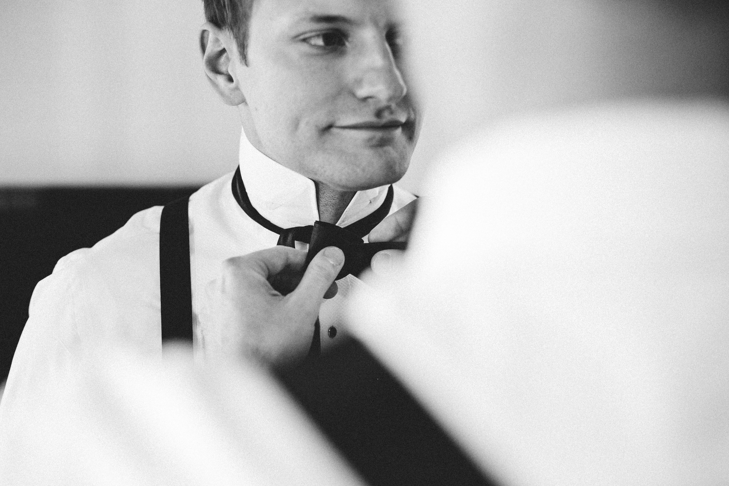 Black and white shot of groom getting ready - Maria Vicencio Photography Weddings