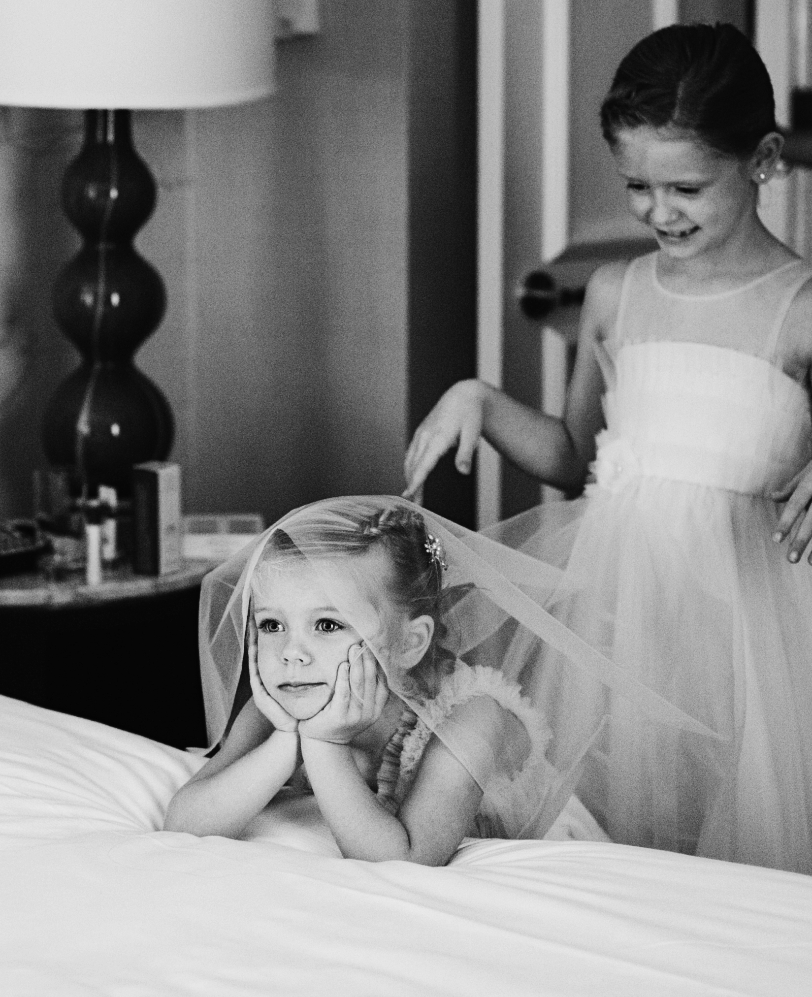 Black and white shot of flower girls waiting for the bride - Maria Vicencio Photography Weddings