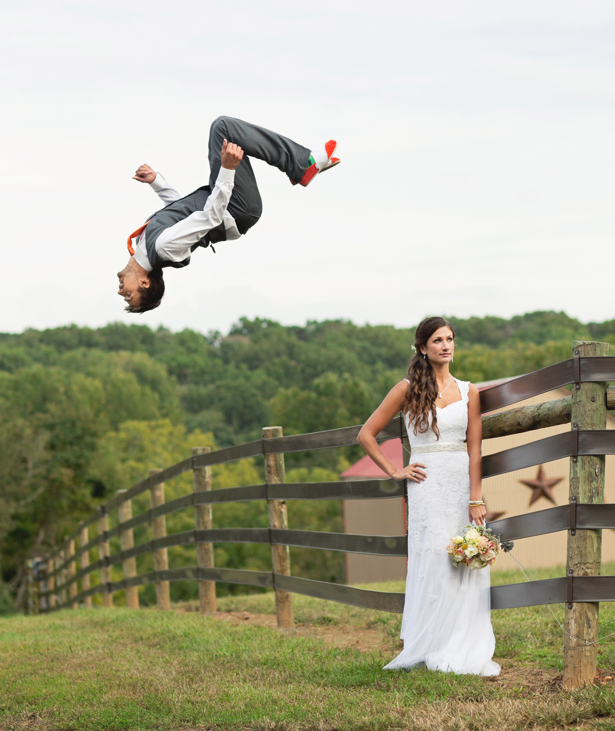 Groom flipping off fence over the bride - Maria Vicencio Photography Weddings