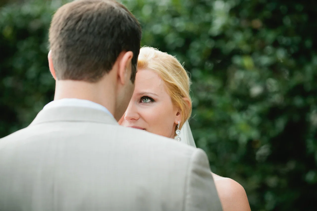Bride looking at her groom with tears in her eyes after ceremony - Maria Vicencio Photography Weddings