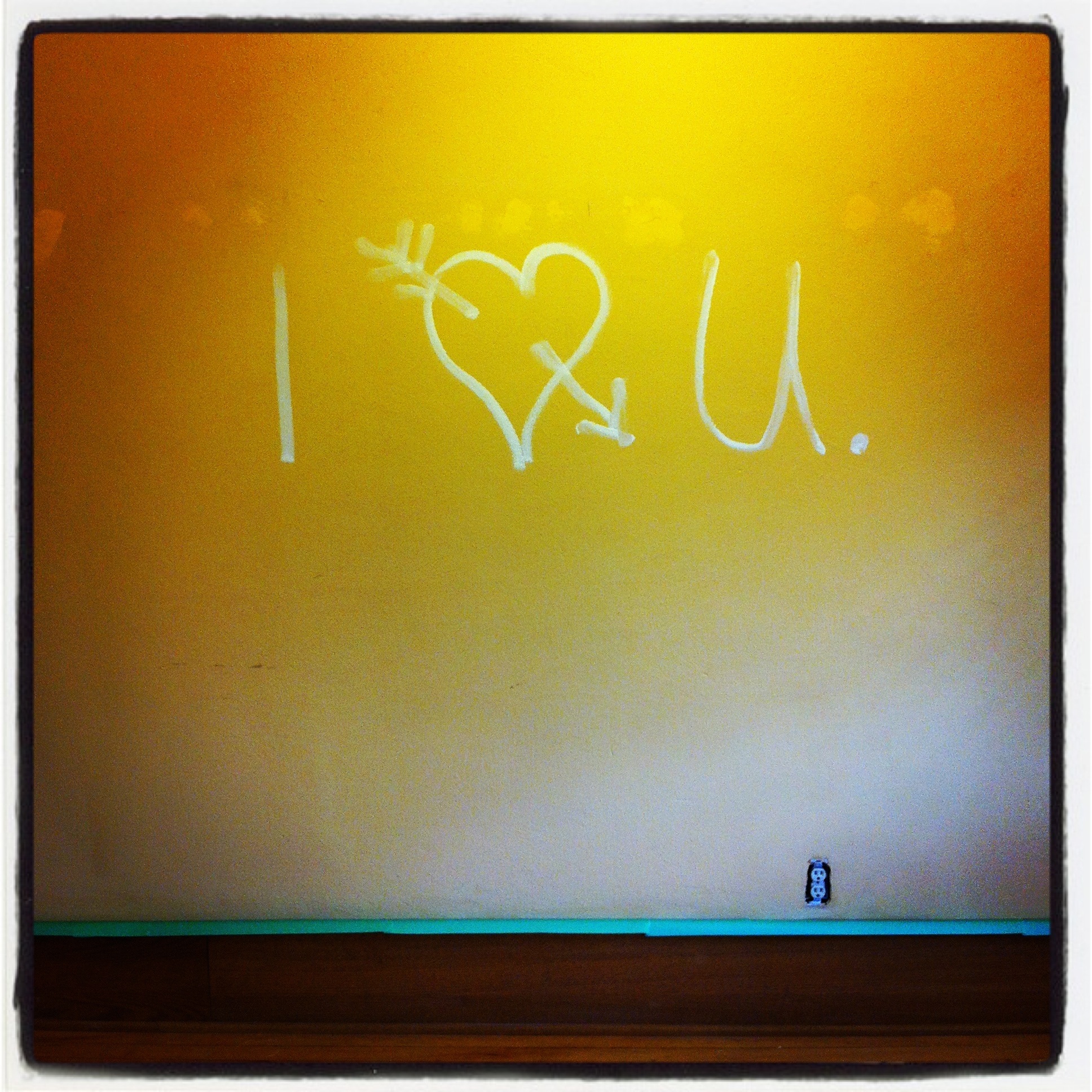 This message lives under the paint on my living room wall.