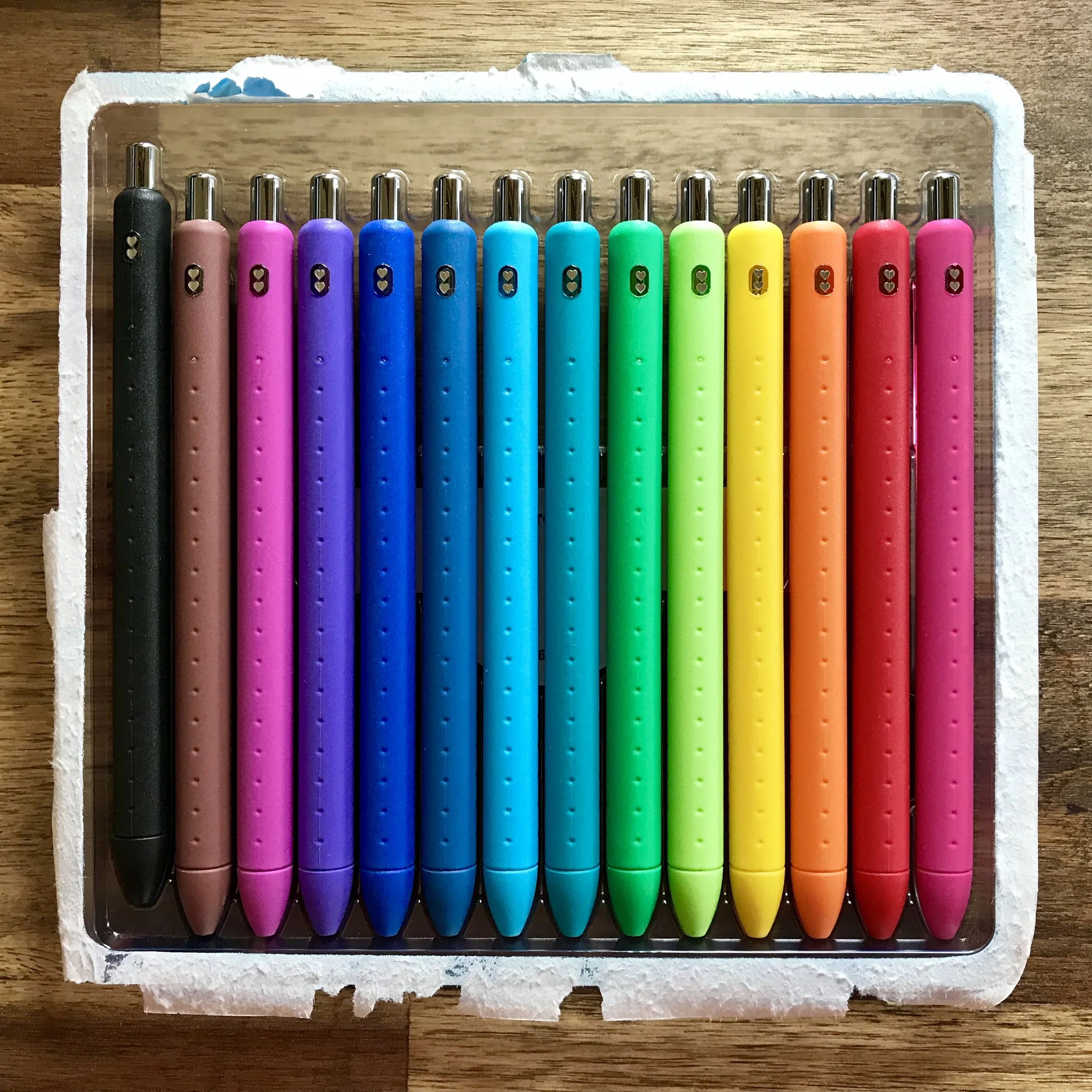 a new set of 14 Paper Mate InkJoy gel pens in the moulded plastic front with the backing cardboard of the package ripped off