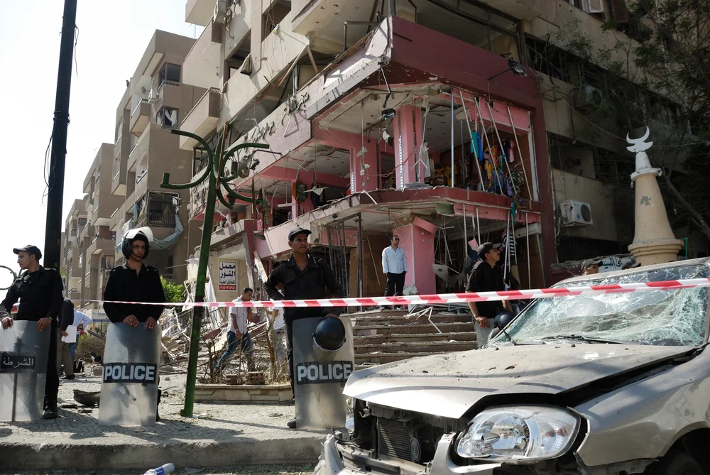 CAIRO - SEP 05: Remains of a big local store at Mostafa Nahas st and neighbors cars after explosion that was targeting the convoy of the Egypt's Interior Minister in Cairo, Egypt on September 05, 2013. Source: Shutterstock .