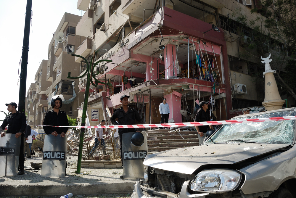 CAIRO - SEP 05: Remains of a big local store at Mostafa Nahas st and neighbors cars after explosion that was targeting the convoy of the Egypt's Interior Minister in Cairo, Egypt on September 05, 2013. Source: Shutterstock.