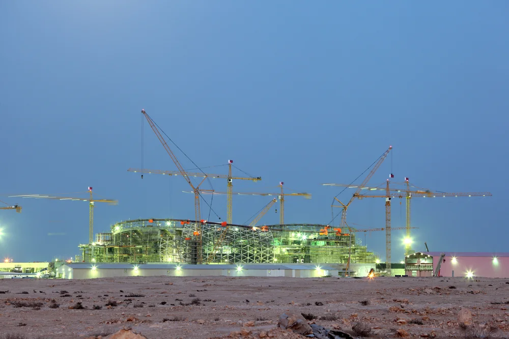 Construction of a new stadium near Lusail in the desert of Qatar. December 16 2013 in Lusail, Qatar. Philip Lange / Shutterstock.com