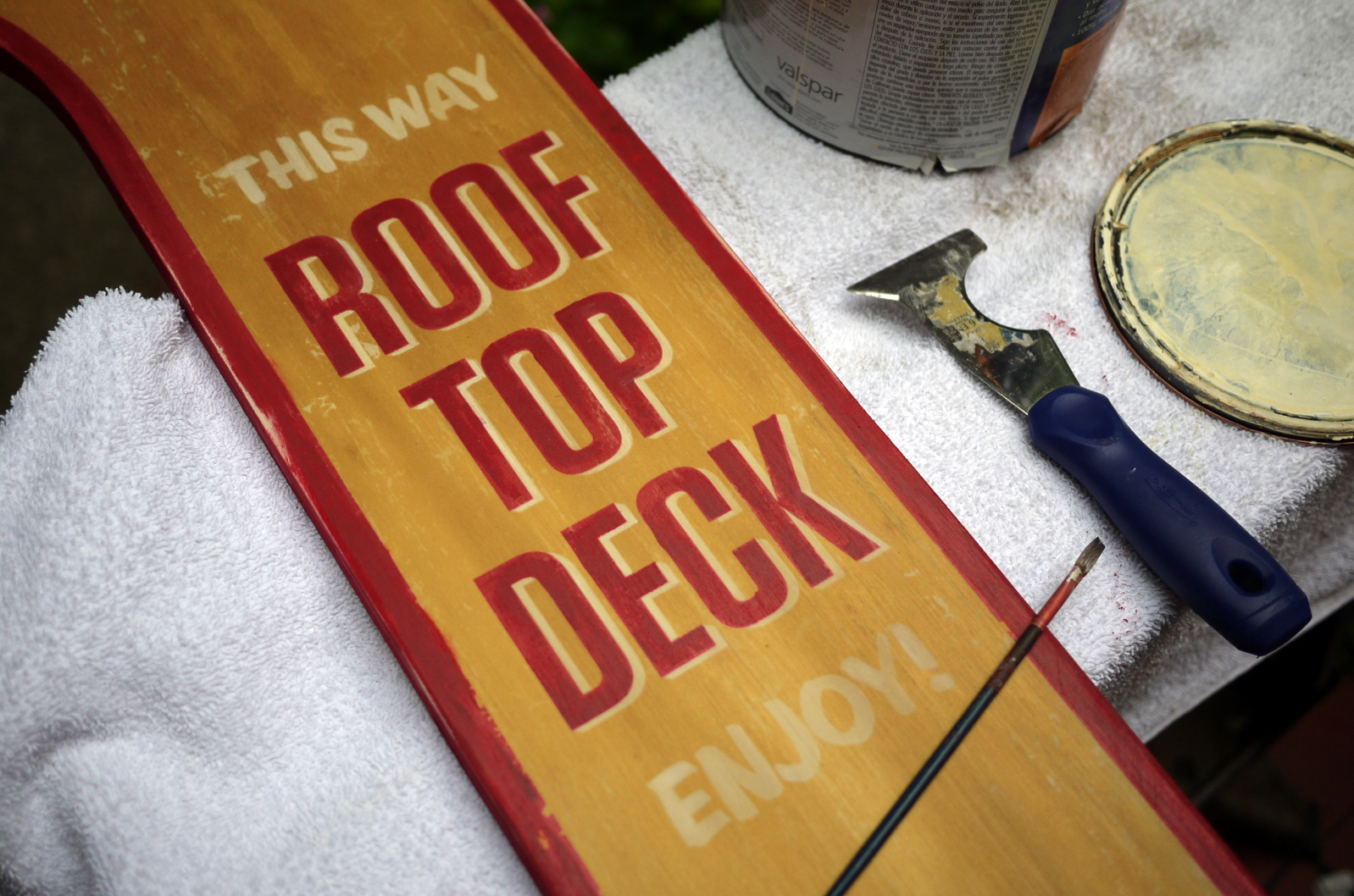 Hand painting edges and adding layers of brushstrokes to type