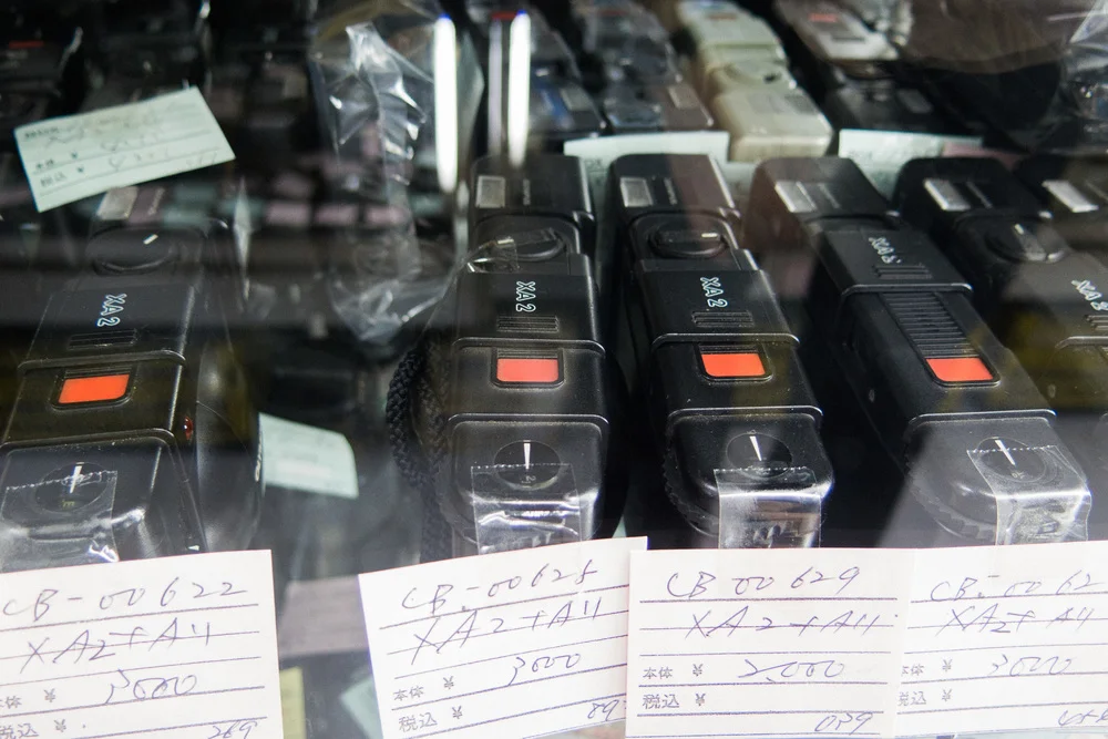 Tons of Olympus XA2 cameras