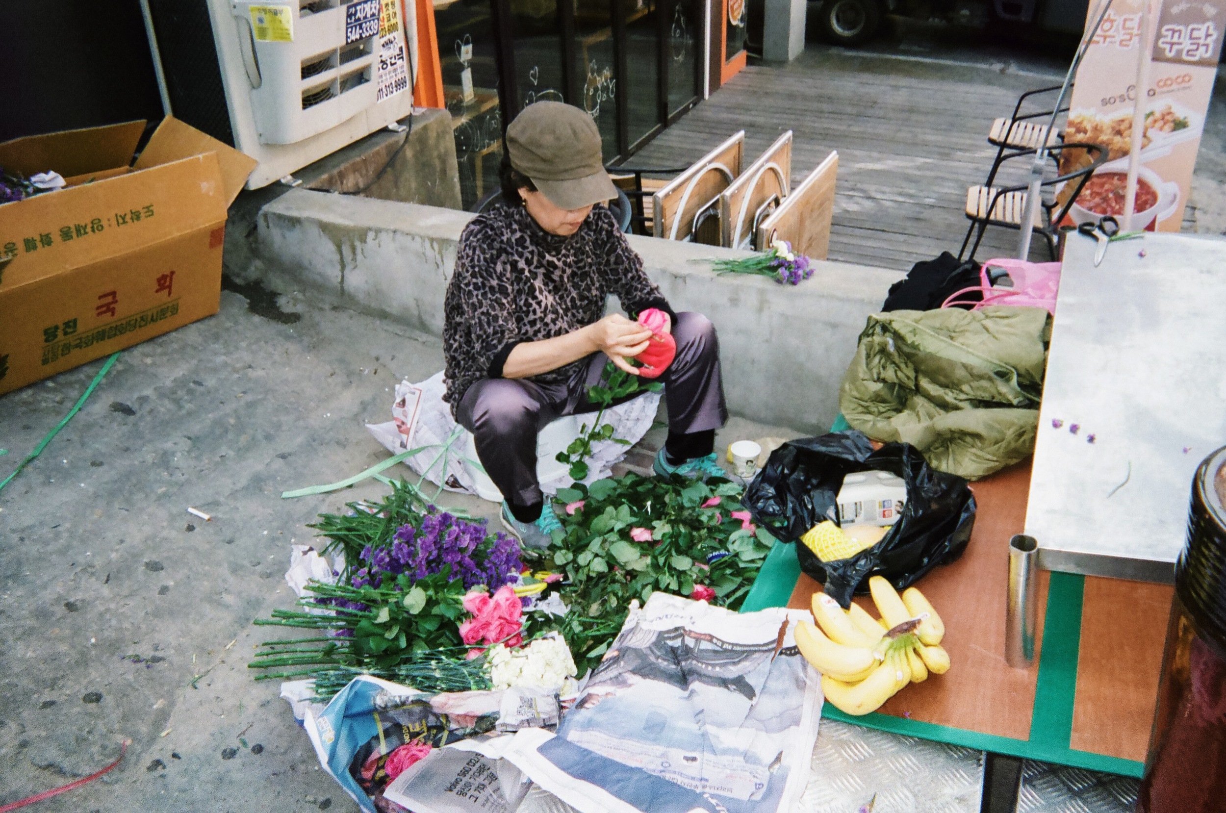 Prepping flowers for sale on the streets of Seoul