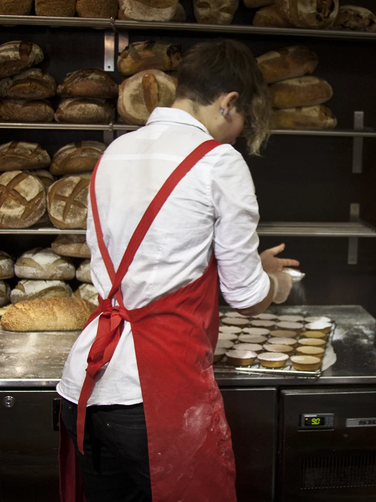 Stall S45 "Dough" and Linda’s daughter dusting the tarts