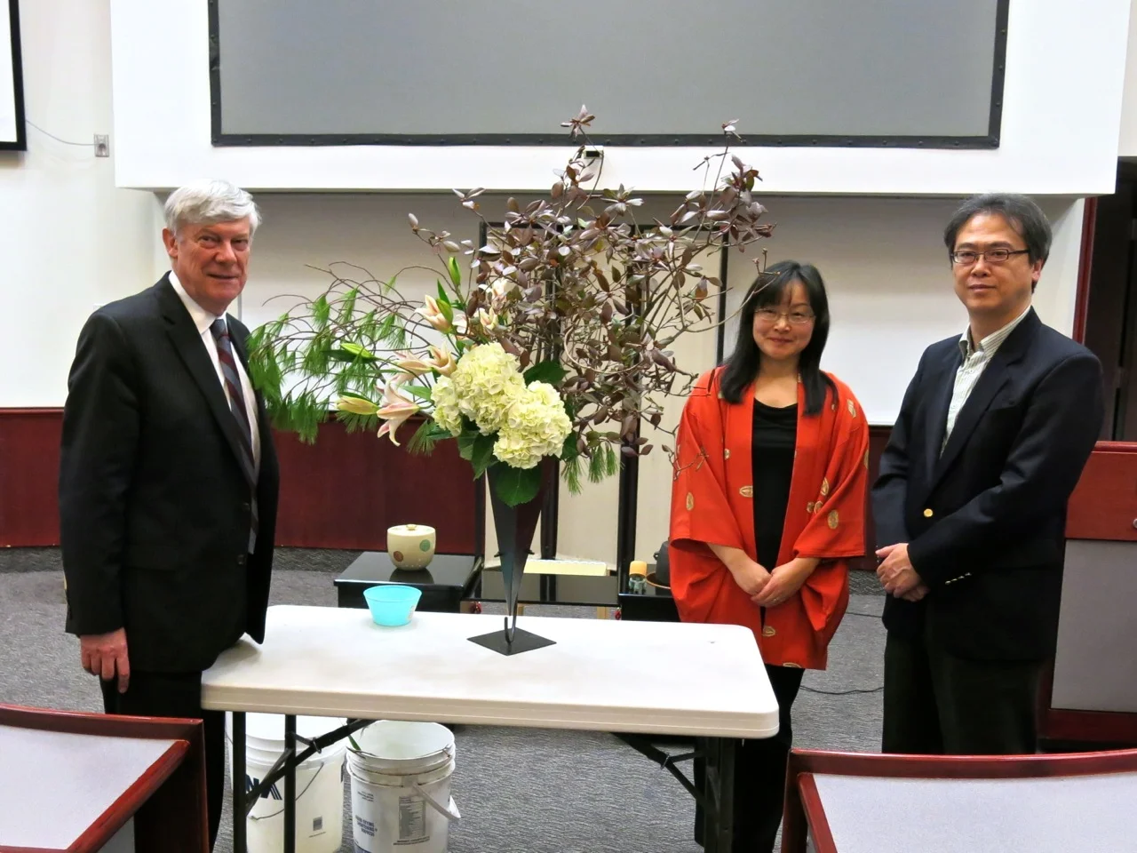 L-R: Dr. J. Colin Dodds, President of St. Mary's University; Miyako Ballesteros, ikebana artist; and Mr. Tatsuo Arai, Consul General of Japan at Montreal.