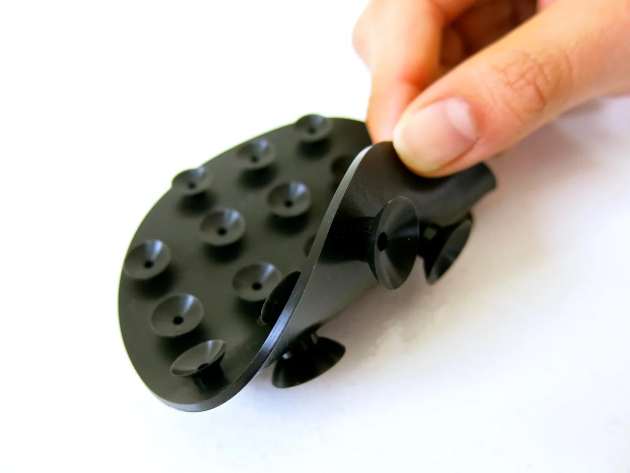 Suction cups below adhere to container.