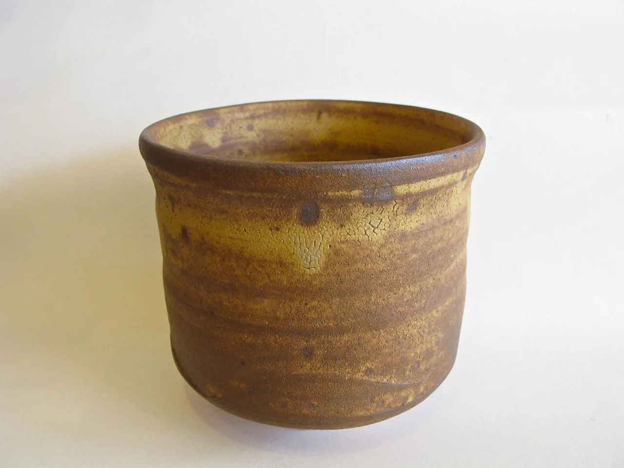 This is a matcha tea bowl that is deeper than what we are used to seeing. It is a "tsutsu-gata chawan" (筒形茶碗) ...literally "cylinder-shaped tea bowl". It is a winter tea bowl normally used in Dec~Feb. The deep bowl keeps the matcha warm as it is served to guests.