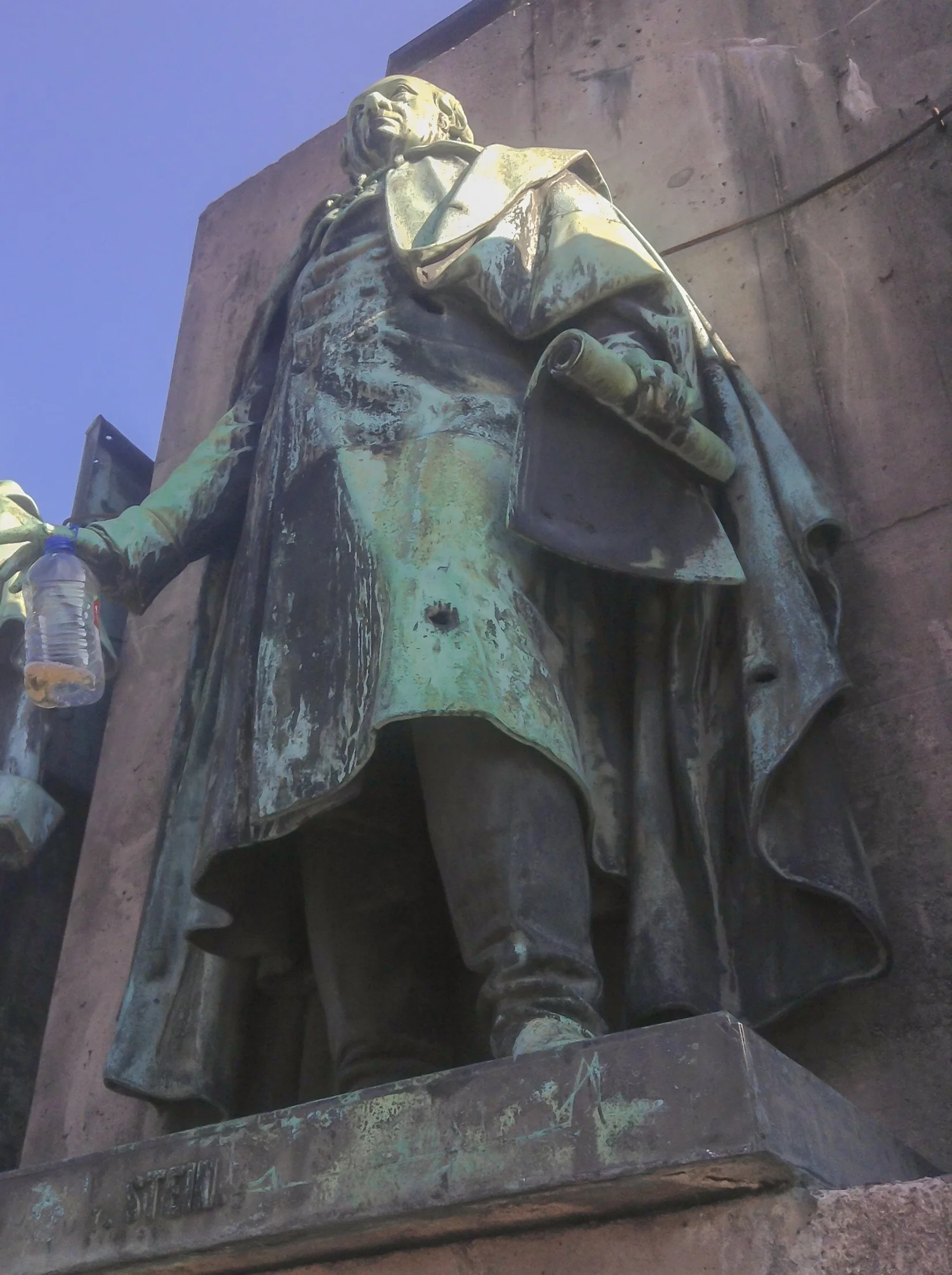 The Equestrian Statue of Friedrich Wilhelm III, Köln, Germany, 2014 The subject of the image is the status of Stein (who stands below William III, but not in the photograph). On closer examination, we can see holes in the bronze. I suspect these are shrapnel “wounds” resulting from the bombing of Cologne during the Second War.