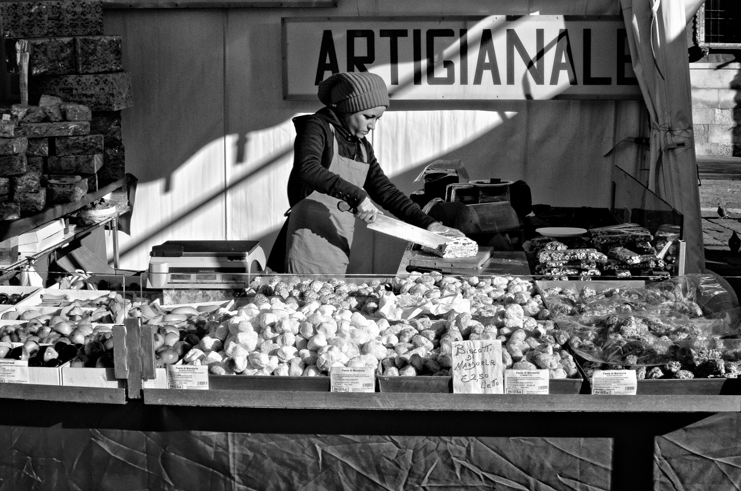Woman Cutting Torrone